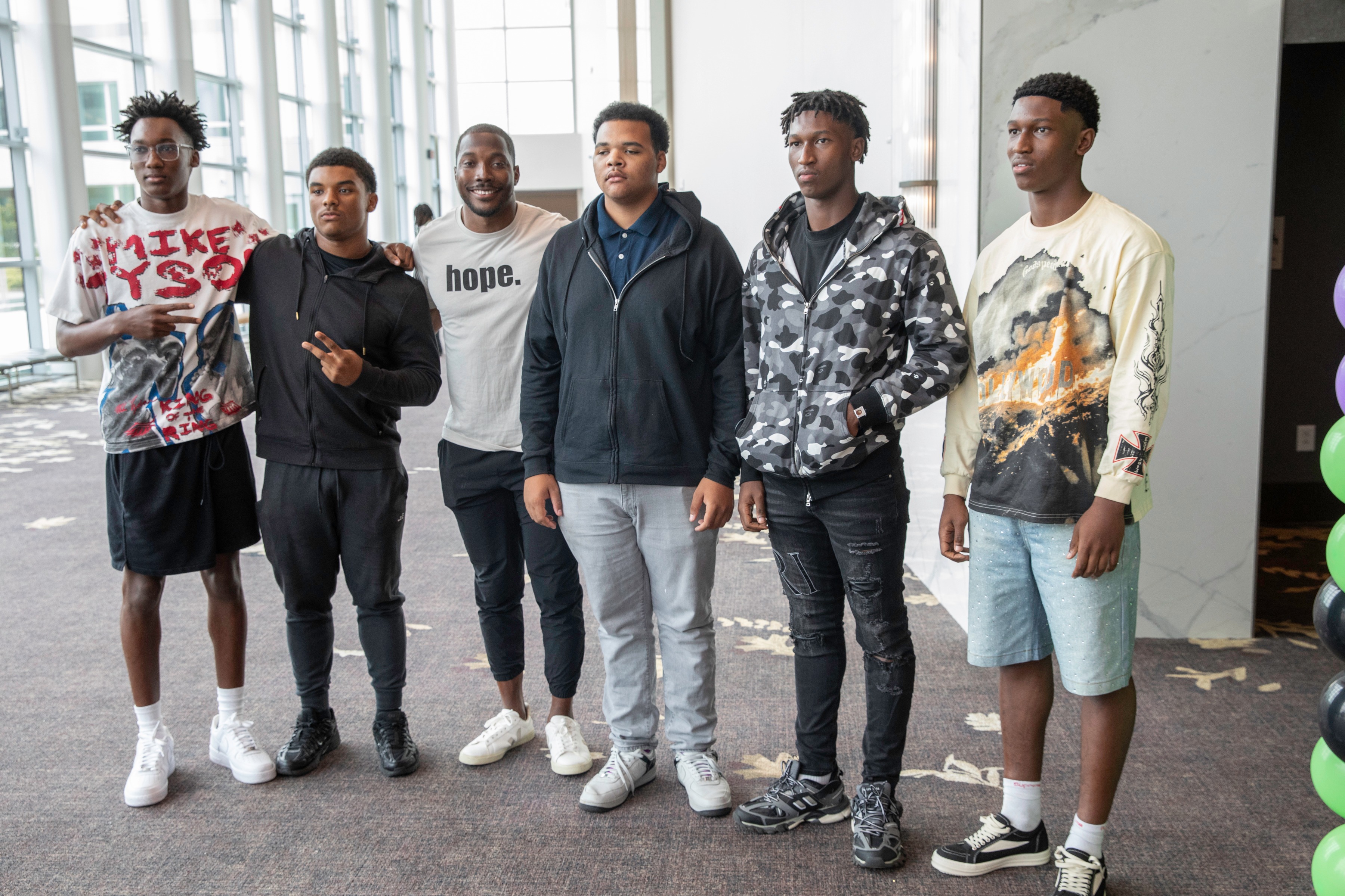 Andre Fluellen standing with a group of students